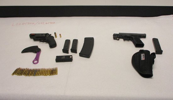 Weapons and ammunition found in the suspect's vehicle.